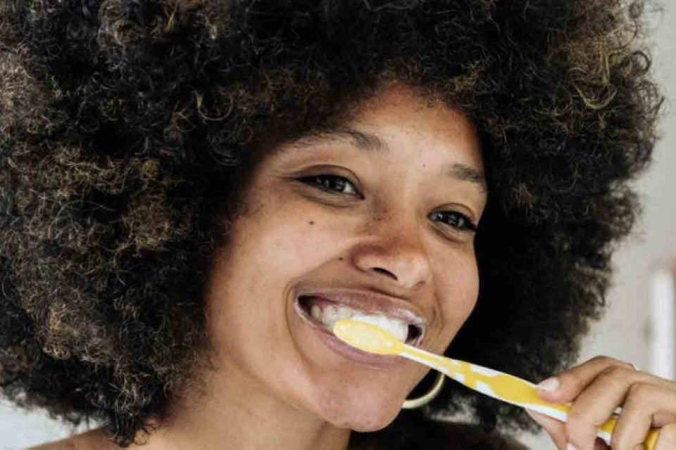 Person brushing teeth